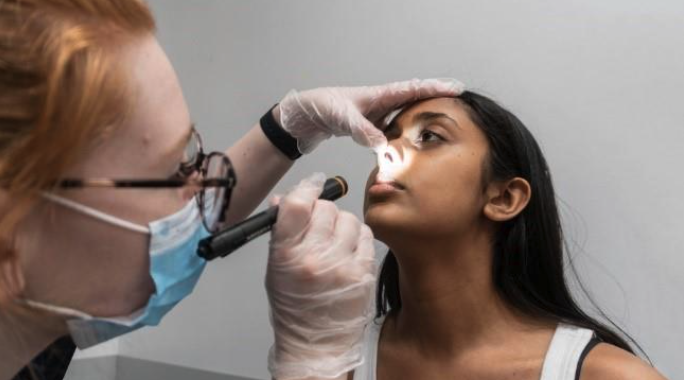 Nasal examination technique showing pig nose manoeuvre