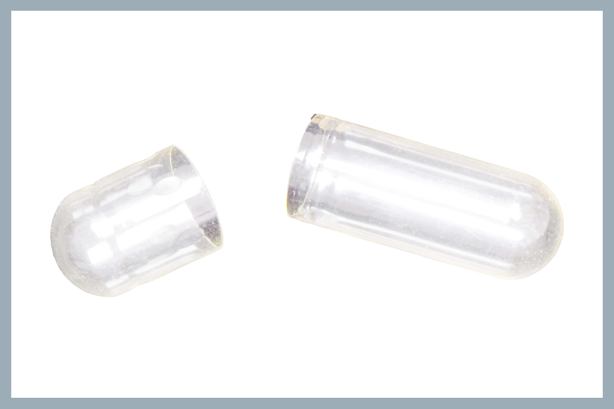 Clear, open capsule
