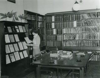 The library in 1952, with Jock's portrait on the mantle, and ashtrays on the table for smokers