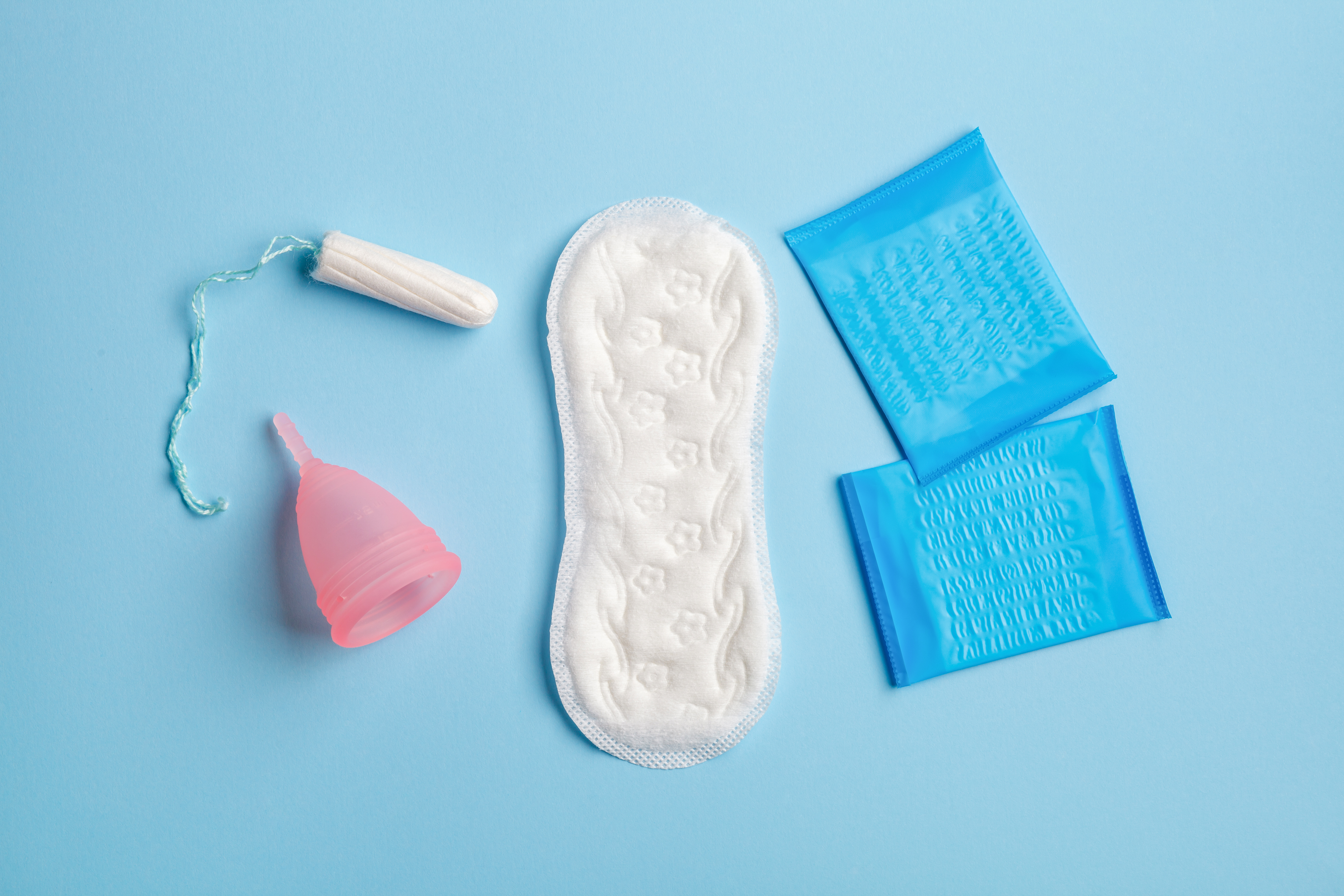 Period products on blue background